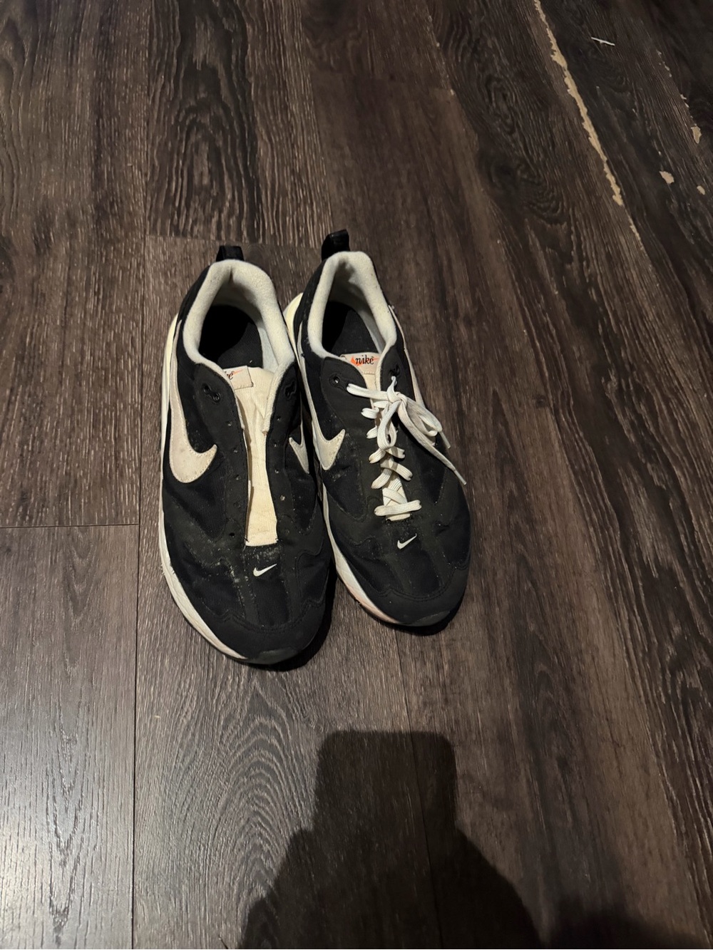 Nike Black and Cream Low-Top Swoosh Sneakers